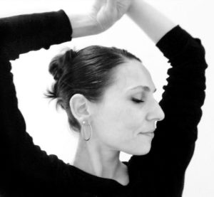 Portrait of ballet instructor Mirella Simoncini  demonstrating a dance move. Portrait for a Ballet Technique Workshop The Hague