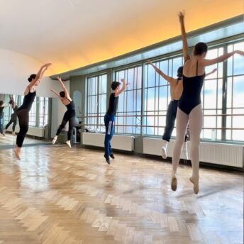 Students jumping energetically during a Summerschool Den Haag choreography workshop